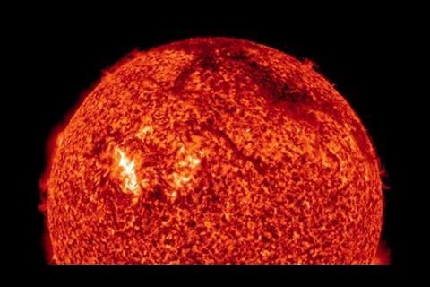 NASA's Solar Dynamics Observatory snapped this X-ray photo of the Sun early in the morning of Sunday, August 1st. The dark arc near the top right edge of the image is a filament of plasma blasting off the surface, part of the coronal mass ejection.